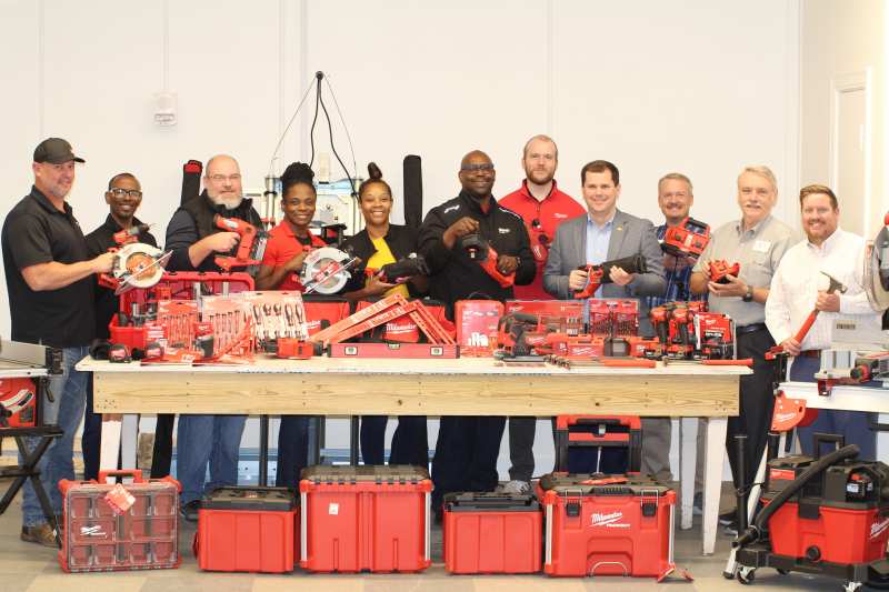 Milwaukee Tool representatives present more than $15,000 worth of power tools to Mississippi College President Blake Thompson, fourth from right, and other 澳门正规前十赌城网 representatives for use in the woodworking studio in the Gore Arts Complex.