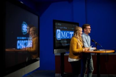 Students learning to speak on TV production set