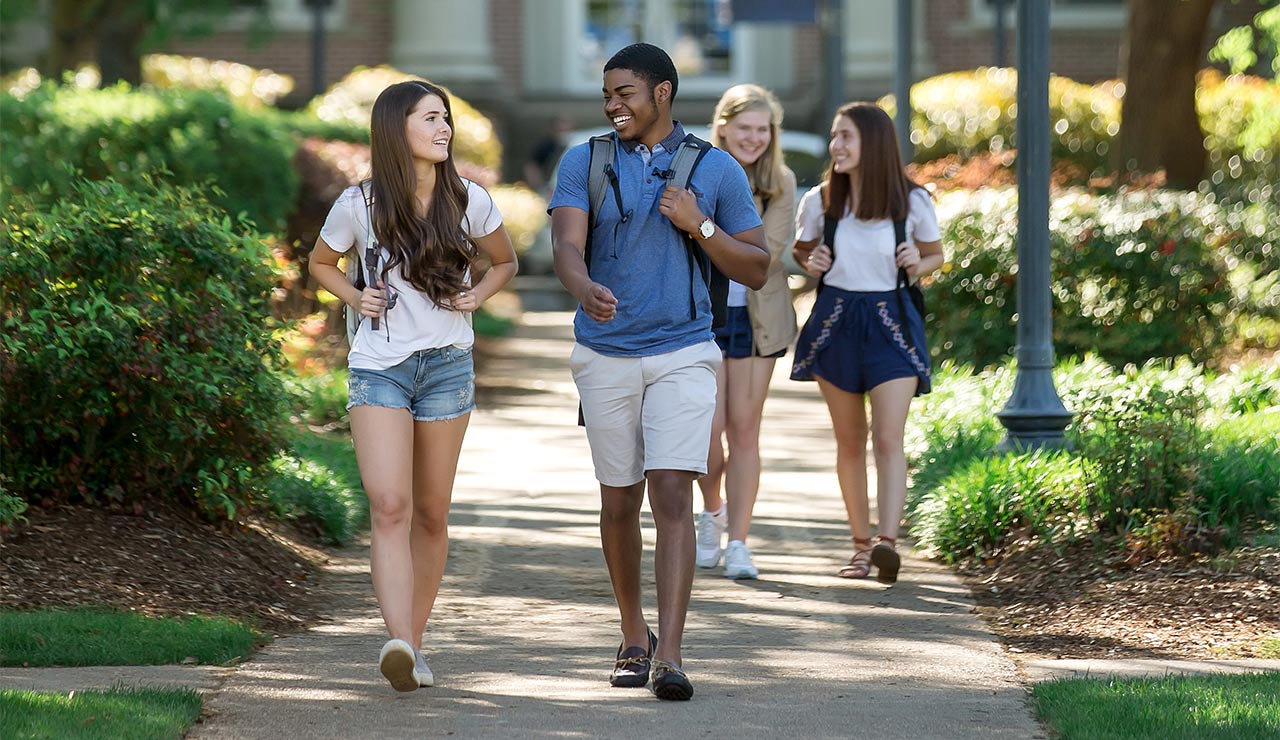 Photo of Students walking along MC's campus