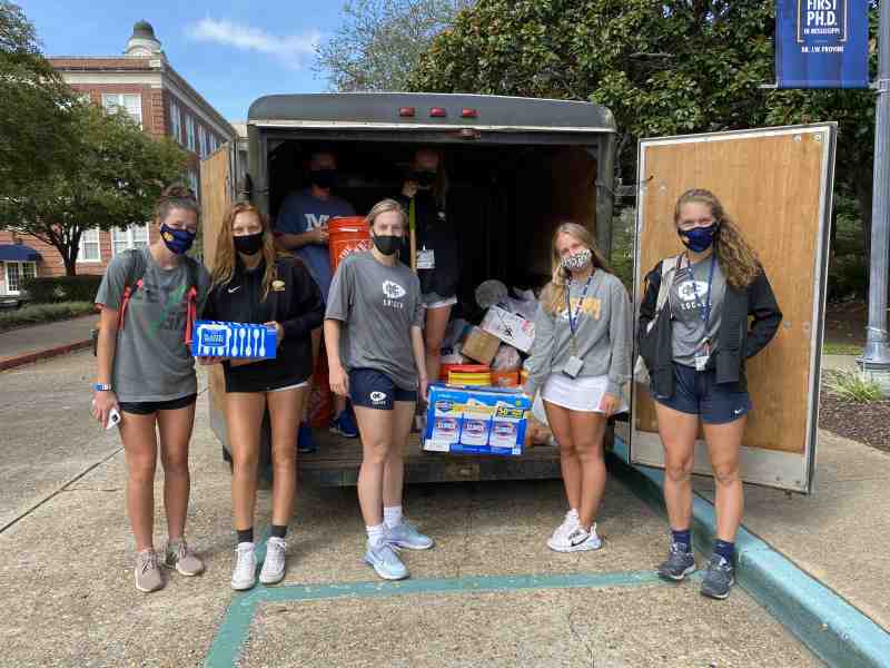MC Lady Choctaws soccer players helped collect donations for Hurricane Laura victims in Louisiana on September 14. Pictured in front of the trailer: Heather Sullivan, Emma Young, Katie Crochet, Maryella White and Avery Hederman. In the back of the trailer: Beatrice Currie and Ashton Storey.