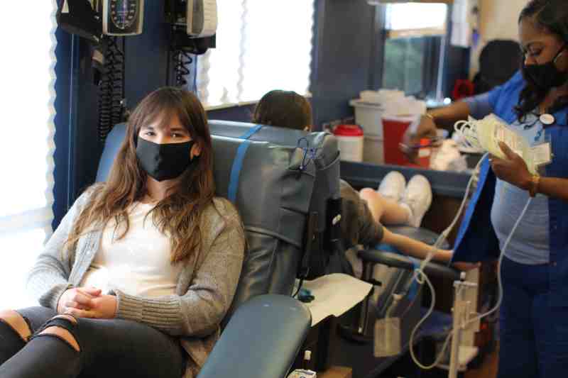Ann Marks donates blood in the MBS donor coach at MC on Jan. 26.