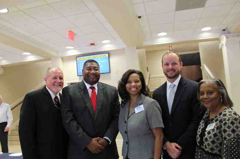 Clinton Superintendent Tim Martin, Assistant Superintendent Anthony Goins and Clinton High Principal Brett Robinson joins Mississippi College professors Jamilliah Longingo and Ruthie Stevenson at MC's Nelson Hall.
