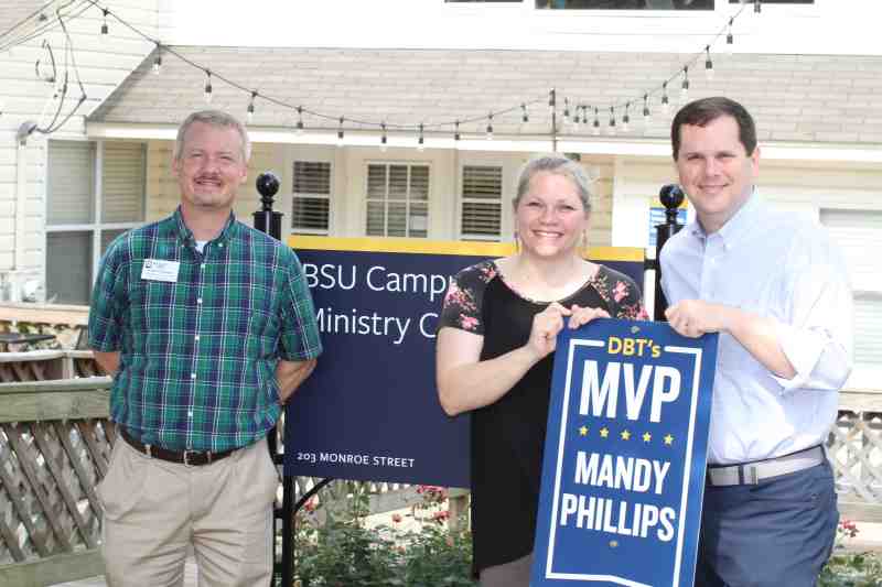 Dr. Blake Thompson, right, MC president, and Nathan Jarnigan, April's DBT's MVP, present the June award to Mandy Phillips outside the Baptist Student Union building.