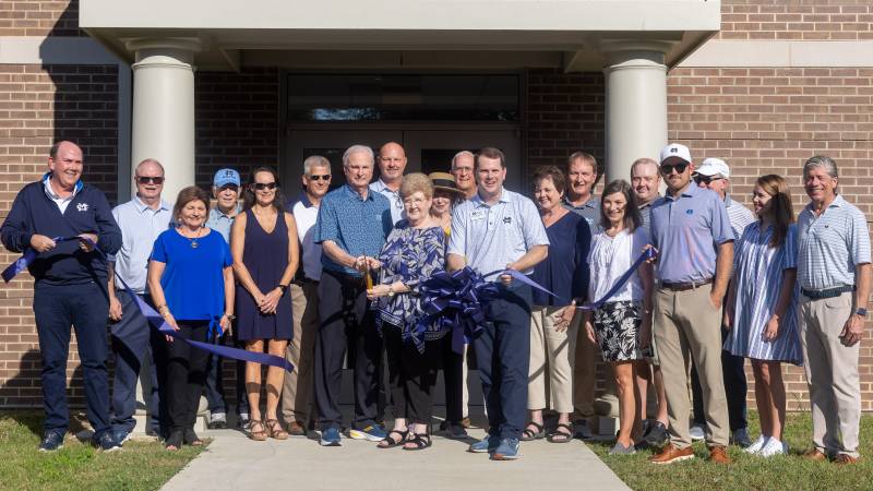 Joining John and Charlotte McMath, center, at the ribbon-cutting are Mississippi College president Blake Thompson; Kenny Bizot, MC athletic director; Ethan Doan, head coach of the MC men’s golf team; Brent Belton, head coach of the MC women’s golf team; and several lead donors.