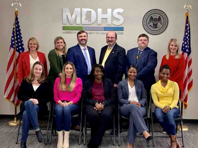 MC Law grad Bob Anderson, the MDHS executive director, is joined by his agency's staff. Those pictured are all MC Law alumni.