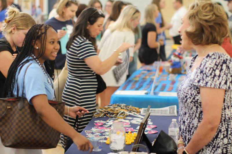 About two dozen organizations at Mississippi College and the surrounding community offer information and giveaways to incoming students during the Orientation Marketplace in Alumni Hall.