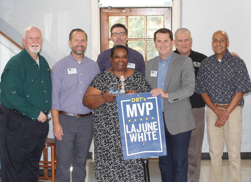 Flanked by MC Department of Christian Studies faculty, MC President Blake Thompson, third from right, presents the DBT's MVP Award to LaJune White.