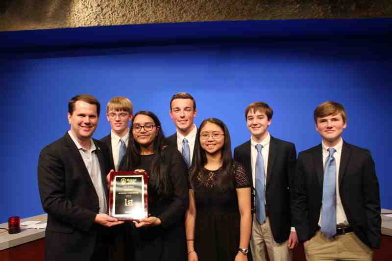 Mississippi College President Blake Thompson hands the first-place award to Madison Central High students at the 35th annual Academic Competition. The December 5 event was held at the Leland Speed Library on the Clinton campus.