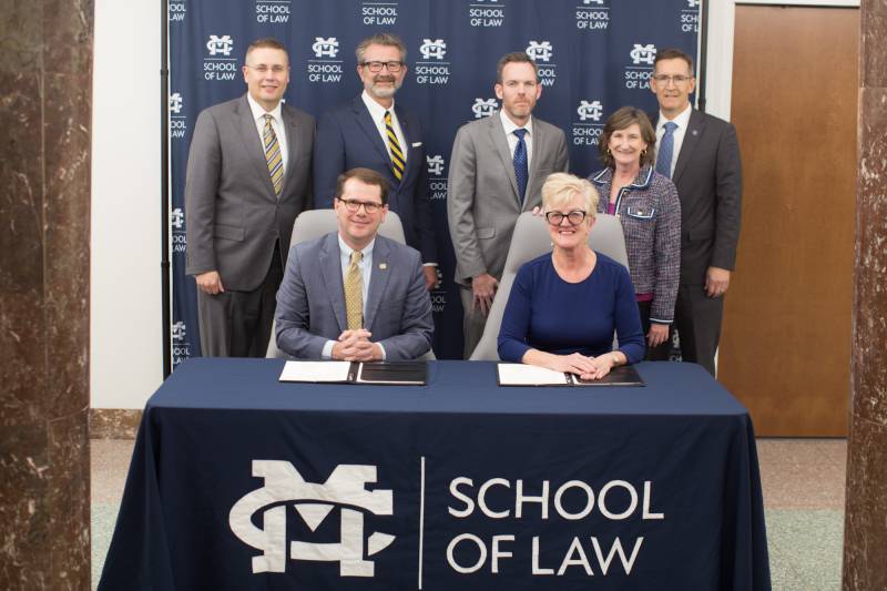 Seated from left, tvPresident Blake Thompson and The W President Nora Roberts Miller, and back row from left, tvProvost and Executive VP Mike Highfield, tvLaw Dean John Anderson, The W Provost and Executive VP for Academic Affairs Scott Tollison, The W College of Business and Professional Studies Dean Kelly Woodford, and The W School of Arts and Science Dean Brian Anderson.