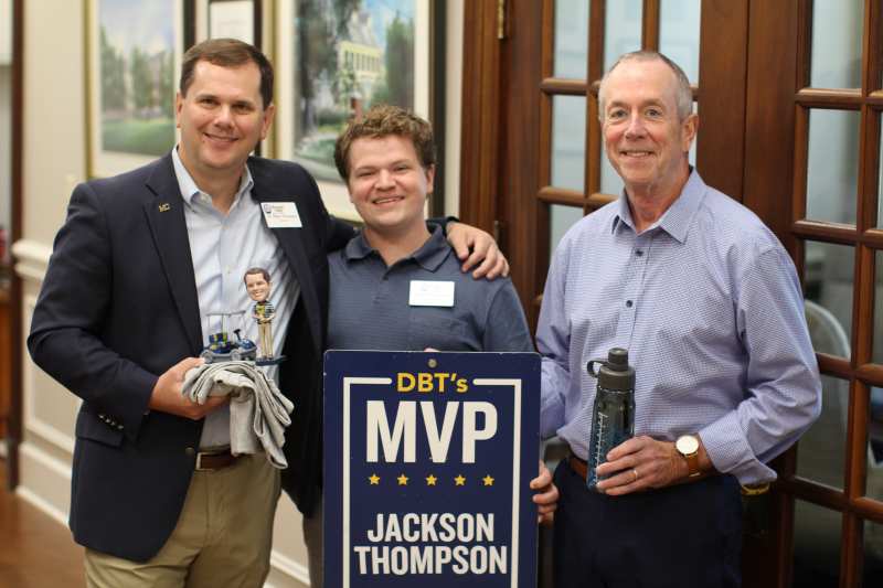 MC President Blake Thompson, left, and Bill Cranford, right, CIO, surprise Jackson Thompson with the October DBT's MVP Award. 
