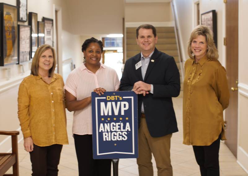 Angela Riggs, second from left, MC assistant bursar, receives the February DBT's MVP Award from MC President Blake Thompson while Laura Jackson, right, MC COO/CFO, and Karen Key, MC assistant controller, observe.