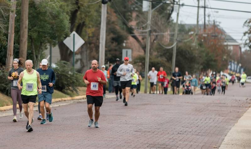 Hap Hudson 5K participants wind through Olde Towne Clinton before ending the race on the Dr. James E. Parkman Track.