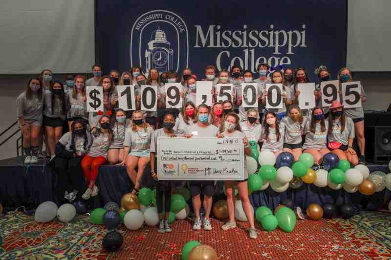 Dance Marathon participants reveal the final support tally at the conclusion of last year's event at Mississippi College.