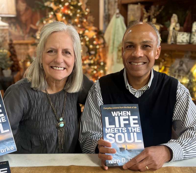 Ivan Parke enjoys a moment with his wife, Mary Ann, during a book-signing event Nov. 12 at The Cupboard Gifts & Interiors in Clinton.