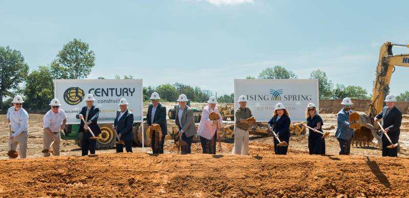 Representatives from Mississippi College, the Mississippi Legislature, and the City of Clinton toss shovelfuls of dirt into the air to celebrate the official groundbreaking of the Rising Spring development.