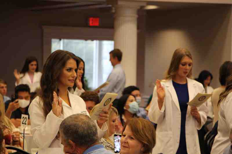 PA students recite the Physician Assistant Oath, pledging to provide for the safety, welfare, and dignity of all human beings.