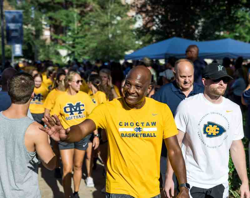Mississippi College fans cheer student-athletes, coaches, and administrators from all varsity sports during the Choctaw Walk in the Quad, part of MC's Choctaw Fanfare.