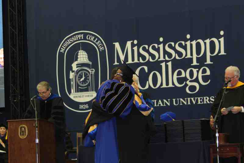 President Blake Thompson hugs Teri Wright, who received the Mississippi College diploma of her late son, Dante Tyrrell Wright at the university's commencement May 11. The MC graduate student from Tupelo was 25 years-old when he died April 2 at a Jackson hospital.