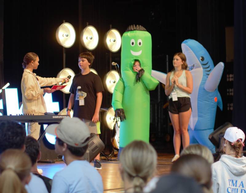 Fuge campers participate in a quiz contest during a morning assembly at 2025 Fuge Camp in MC's Swor Auditorium.