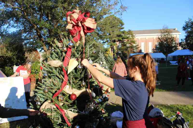 MC students have fun decorating Christmas trees at Lighting of the Quad festivities on the Clinton campus.