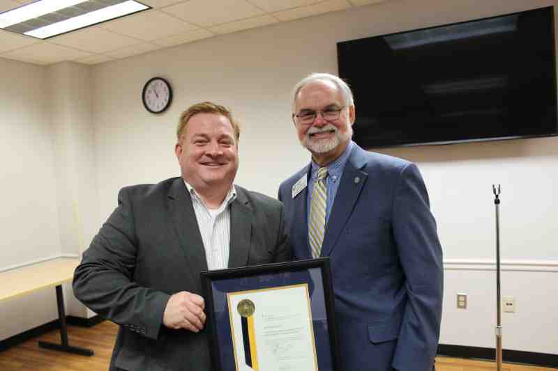A 1995 Mississippi College communication graduate. Mark Jones joins MC Communication Chair Cliff Fortenberry. Jones was named the department's Alumnus of the Year.