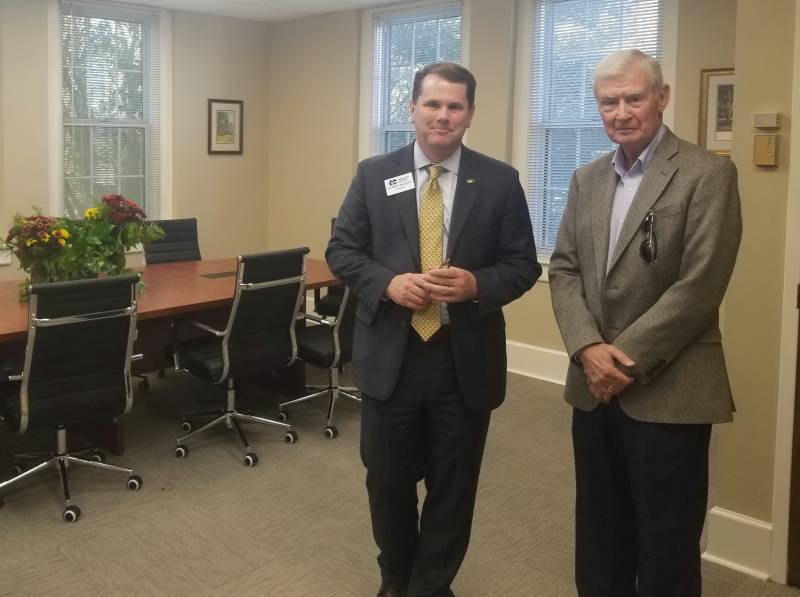 MC President Blake Thompson, left, visits with Dr. Kirk Ford, chair and professor emeritus of history, in the seminar room named in Ford's honor.