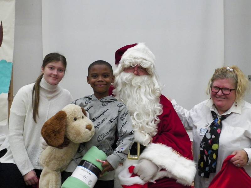 Residents of the Wingard Home enjoy participating in a devotional, eating a warm holiday meal, and meeting Santa.