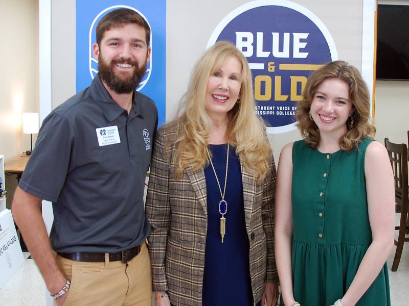 Dr. Beth Baker-Janser, center, visits with Mississippi College Department of Communication students Cole Benoit, agency director of Big River Strategies, and Emma Ellard, Blue and Gold Media editor-in-chief.