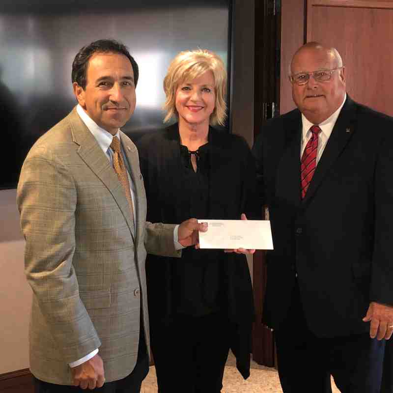 Mississippi School of Business Dean Marcelo Eduardo and assistant dean Michele Ricker announce a new scholarship.