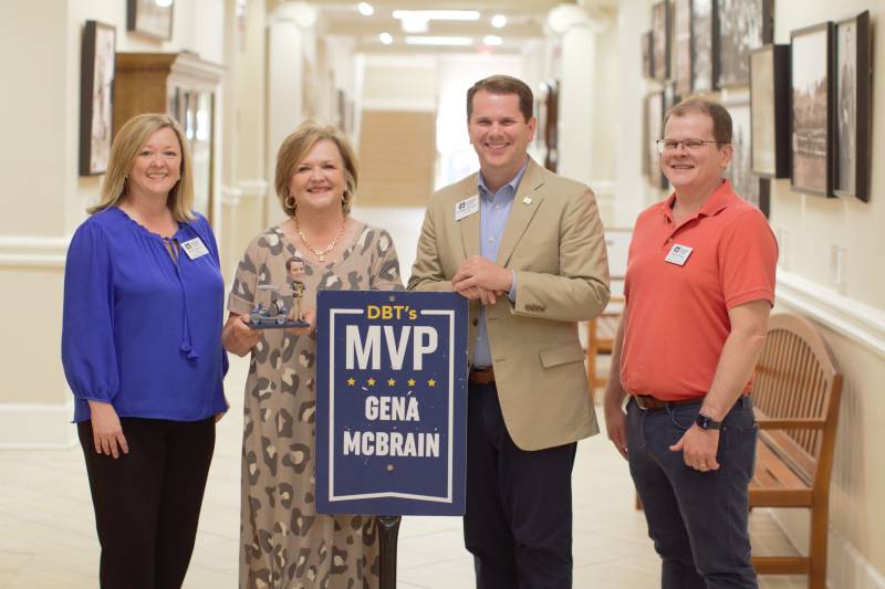 ±«ÓătvPresident Blake Thompson, second from right, presents the DBT's MVP Award for May to Gena McBrain, second from left, ±«Óătvpayroll administrator, while Ebby Dedeaux, ±«Óătvcontroller, and Robert Turnage, the DBT's MVP for March, observe.