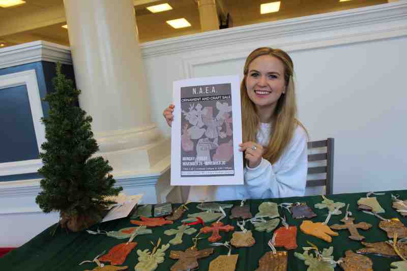 Mississippi College art education students crafted Christmas ornaments on sale at the school cafeteria. MC student Vashti Graham of Meridian is pictured promoting the annual holiday season event on the Clinton campus on November 26. Funds raised will help MC students pay their expenses to attend a national art education conference in Boston in March 2019.