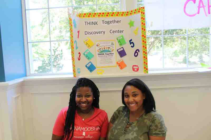 MC seniors Khalia Terry and Taylor Haymore sign up volunteers for tutoring center in Clinton.
