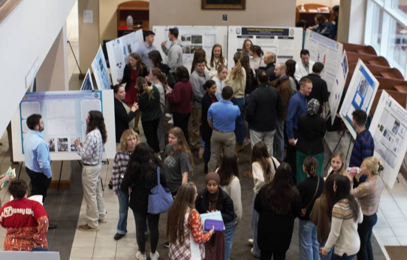 Student researchers showcased their research posters and discussed their findings during the Fall 2024 Mississippi College Research Symposium.  