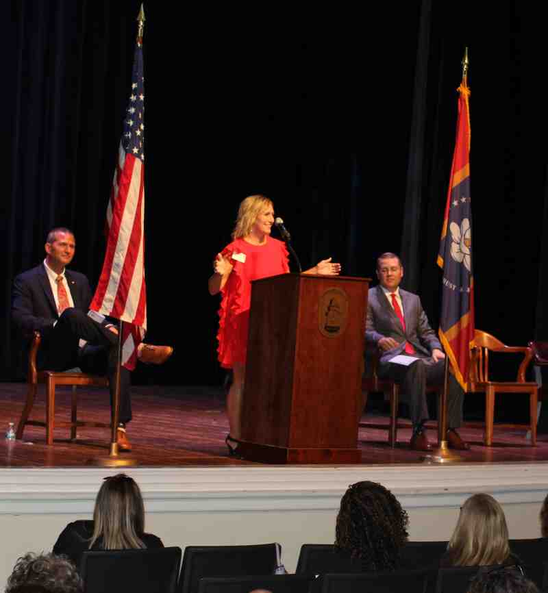 Cindy Melton, dean of the School of Education at MC, welcomes members of the Clinton Public School District to 2023 Convocation in Swor Auditorium while Andy Schoggin, left, CPS superintendent, and Michael J. Highfield, acting provost and graduate dean at Mississippi College, listen.