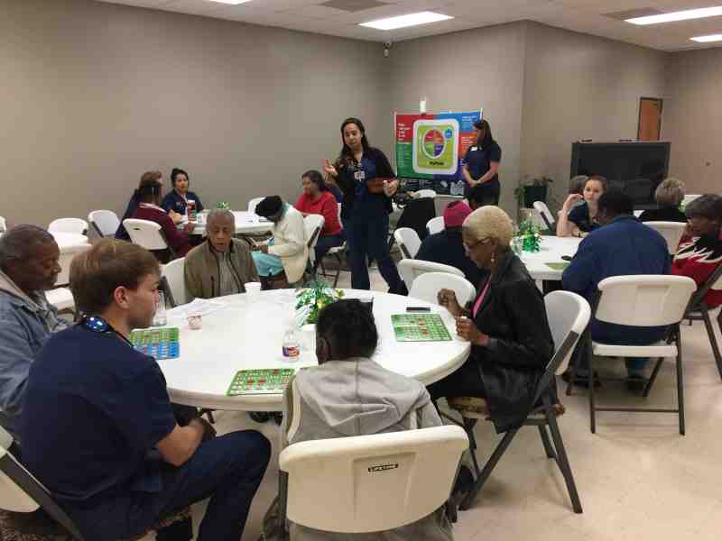 Mississippi College nursing students play bingo with senior citizens at the 4Cs in Clinton. MC students serve as volunteers there year-round.