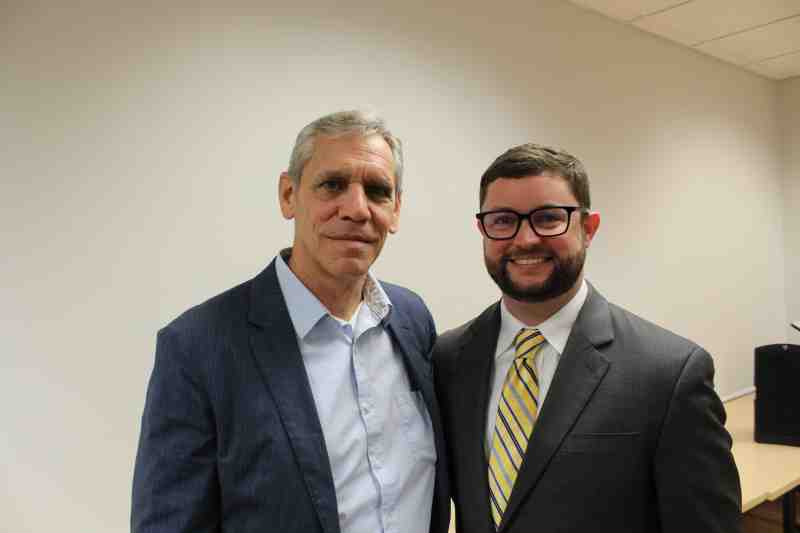 Mississippi College debate team coach Merle Ziegler joins Communication Department Distinguished Graduate of the Year Randall Miller for a photo at a 2019 Homecoming reception. A 2011 MC graduate and attorney, Miller is a former debater at the Christian university.